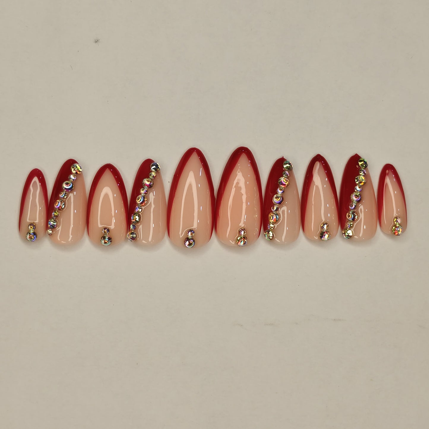 Red Side French Nails with Stone Embellishments